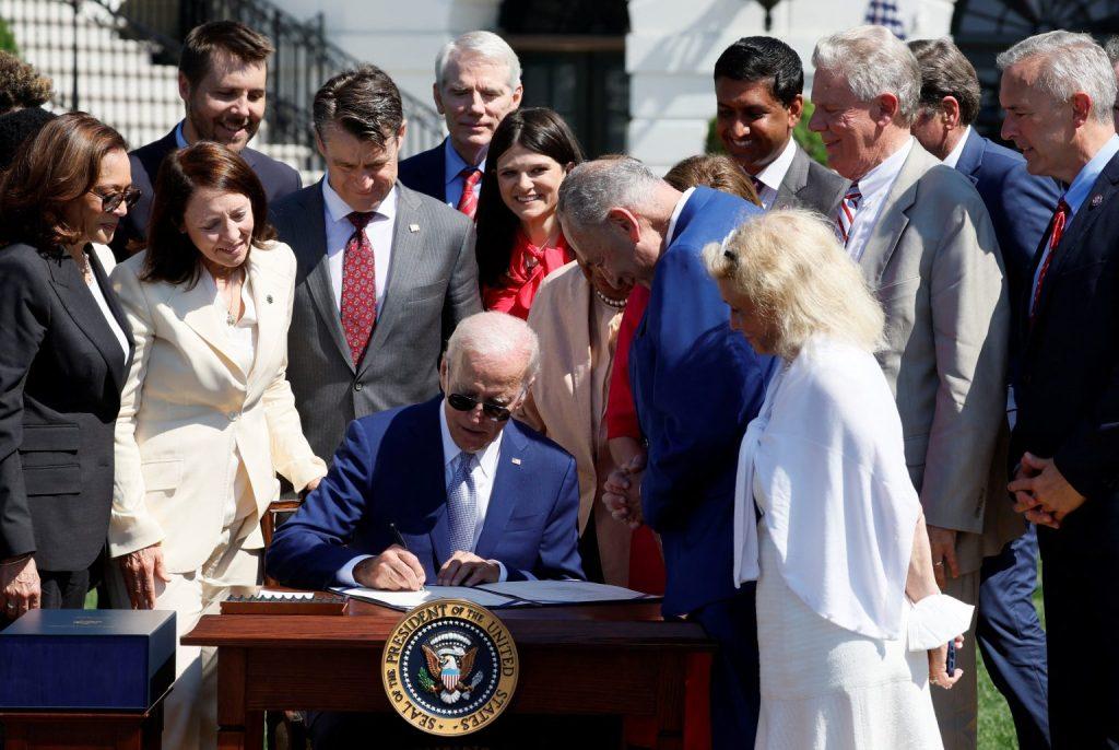 U.S. President Joe Biden signs the CHIPS and Science Act of 2022 alongside Vice President Kamala Harris